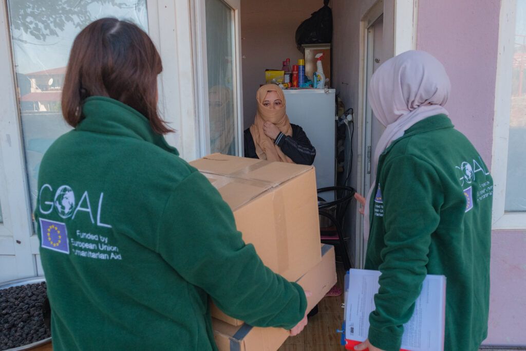 Displaced mother of three, Aisha, welcoming GOAL into her home with EU funded-aid. 